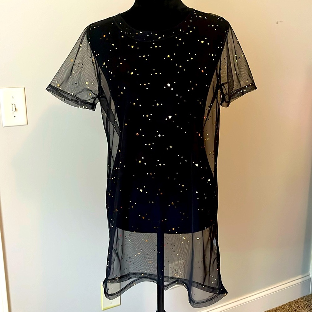 Sheer black top with gold stars.